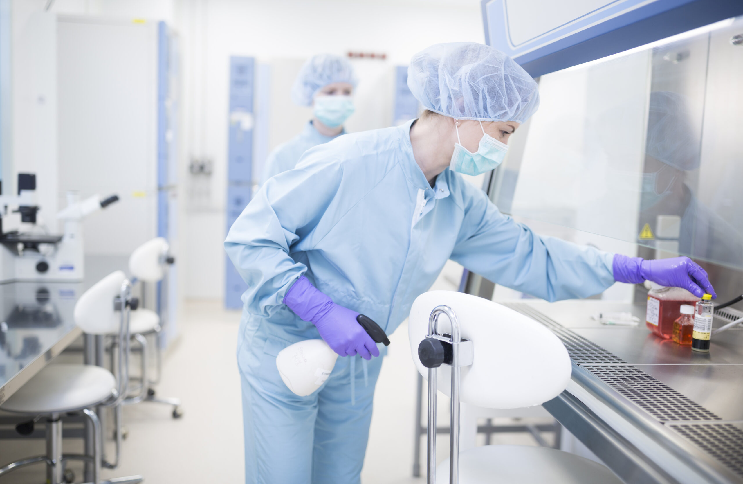 Woman working in life science cleanroom facility